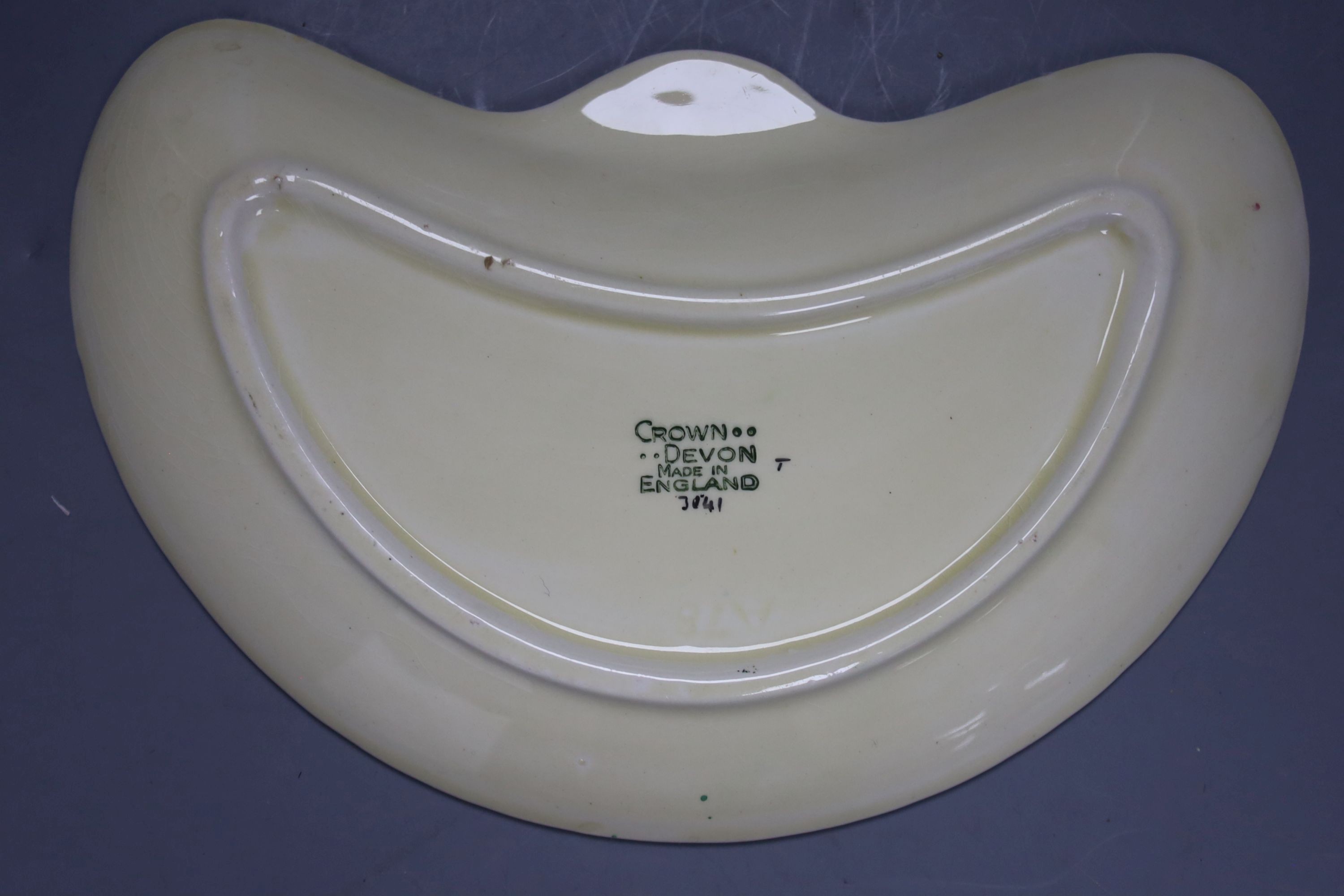 An Art Deco style jug and vase, wall mask and Crown Devon dish